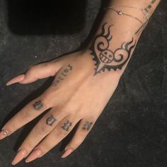 a woman's hand with tattoos on it and the word love written in cursive writing