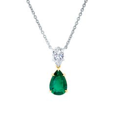 Eye-catching emerald and diamond necklace. Features a pear shape emerald set in 18k yellow gold, and a pear shape diamond set in platinum. The platinum chain is 18" in length. Emerald = 3.04 carats Diamond = 1.22 carats Luxury Brilliant Cut Pear-shaped Emerald Necklace, Elegant Green Pear-shaped Diamond Necklace, Luxury Green Pear-shaped Emerald Necklace, Green Briolette Emerald Necklace For Formal Occasions, Formal Green Briolette Emerald Necklace, Formal Briolette Green Emerald Necklace, Pear-shaped Emerald Necklace, Green Pear Shaped Necklace For Formal Occasions, Green Pear-shaped Necklace For Formal Occasions