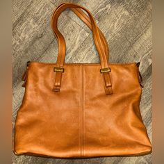 In Great Condition Cognac Textured Leather Bag For On-the-go, Chic Leather-backed Bags For Daily Use, Cognac Satchel With Leather Backing For Shopping, Tan Leather Tote Hobo Bag, Leather-backed Tote Bags For Office, Classic Tan Shoulder Bag For Everyday Use, Tan Hobo Bag For Travel, Office Tote Bags With Leather Backing, Office Shoulder Bag With Double Handle And Leather Backing