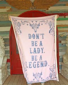 a pink and blue banner that says don't be a lady, be a legend