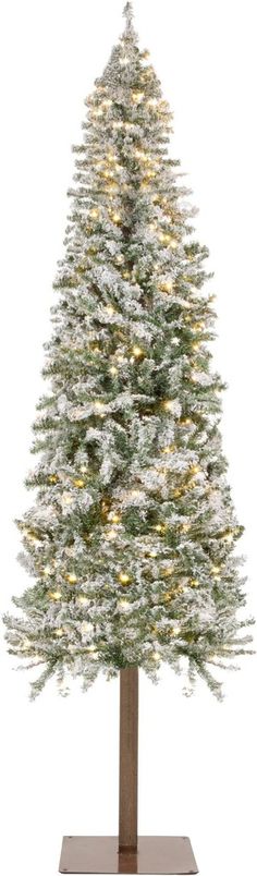 a white christmas tree with lights on it