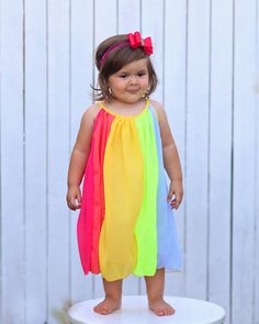 Panels of rainbow colors add a fun flair to this twirl-worthy shift dress. 100% polyester skirt We recommend hand washing and hang drying this article of clothing. Fun Multicolor Summer Dress, Rainbow Summer Dress For Playtime, Rainbow Summer Dresses For Playtime, Summer Rainbow Playtime Dress, Colorful Playful Sleeveless Dress, Colorful Sleeveless Playful Dress, Playful Multicolor Sundress For The Beach, Fun Multicolor Sundress For Playtime, Multicolor Sundress For Summer Play