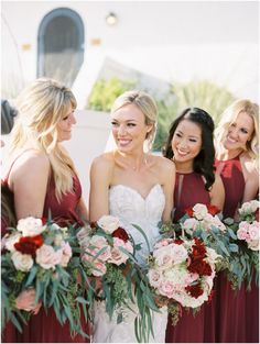 the bride and her bridesmaids are holding their bouquets