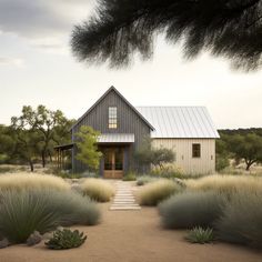 the house is surrounded by tall grass and trees