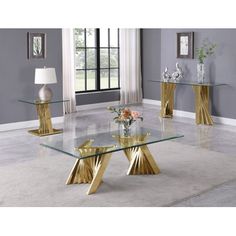 a glass table with gold metal legs in a living room