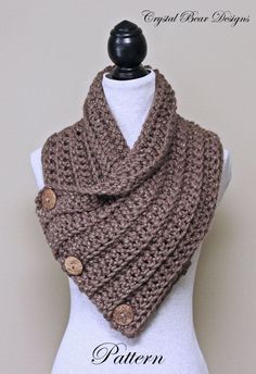 a knitted cowl with buttons on it