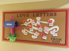 a bulletin board decorated with hearts and mailboxes