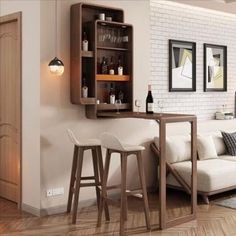 a living room filled with furniture next to a wall mounted wine rack and two bar stools