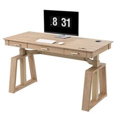 a computer desk with a clock on it