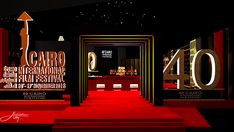 the red carpeted entrance to an event is lit up