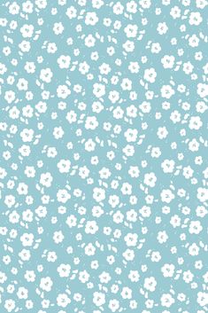 a blue and white flowered background with small white flowers on the bottom right corner