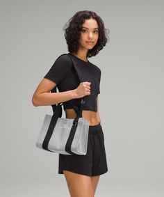 Your New Catch-All. This Structured Mini Tote Comes In A Textured Two-Tone Canvas That Holds Both Its Shape And Your Belongings. Designed For Casual. Bag Dimensions: 28Cm X 13Cm X 21Cm (11" X 5.1" X 8.3"):strap Length When Fully Extended: 150Cm (59"):volume: 4.5L. Removable, Adjustable Shoulder Strap. Front Pocket To Store Your Essentials. Clip A Nano Pack Or Keychain Onto The D-Ring. Snap Closure. Zippered Interior Pocket. Interior Drop-In Pocket. | Two-Tone Canvas Mini Tote Bag 4.5L Versatile Lululemon Shoulder Bag For Everyday Use, Casual Lululemon Bags For Daily Use, Everyday Casual Lululemon Bags, Casual Everyday Lululemon Bags, Ring Snap, Light Ivory, Mini Tote Bag, New Mothers, Mini Tote