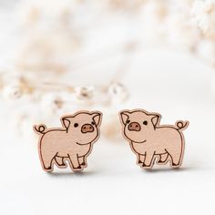 small wooden pig earrings on white background