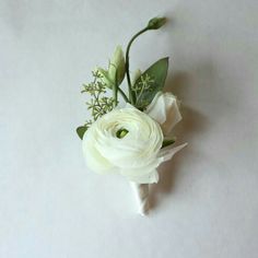 a bouquet of white flowers sitting on top of a table