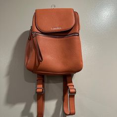 Never Used Orange Calvin Klein Mini Book Bag 5 Compartments Retails For $100 Open To Offers!! Calvin Klein Satchel Shoulder Bag With Zipper, Calvin Klein Leather Shoulder Bag For Travel, Calvin Klein Crossbody Travel Satchel, Calvin Klein Satchel With Adjustable Strap, Calvin Klein Crossbody Satchel For Travel, Calvin Klein Travel Shoulder Bag With Removable Pouch, Calvin Klein Shoulder Bag With Removable Pouch For Travel, Calvin Klein Travel Shoulder Bag With Detachable Strap, Calvin Klein On-the-go Bags With Zipper Closure