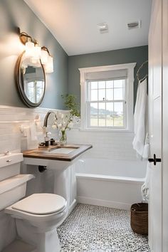 a bathroom with a sink, toilet and bathtub next to a window in it