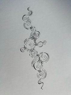 an artistic tattoo design is shown on the back of a sheet of white paper with black ink