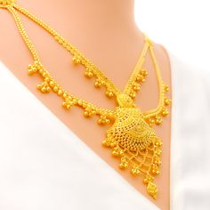 This 22k gold light patta set features a traditional festive tasseled design, perfect for adding elegance to any outfit. Weighing 55.0 grams, it showcases a yellow gold finish that enhances its intricate and celebratory appearance. The set has a length of 24 inches with a 2.5-inch drop and includes adjustable 1.5-inch links for a comfortable fit. Secured with a hook lock, it combines style and practicality. The matching earrings, each 2.2 inches long, feature screw back posts for added security. Festive Gold Jewelry With Zari Weaving, Gold Zari Weaving Jewelry For Weddings, Traditional Yellow Gold Plated Temple Necklace, Gold Temple Necklace With Tilla For Eid, Elegant Gold Temple Necklace With Latkans, Festive Yellow Gold Temple Necklace With Latkans, Traditional Yellow Gold Temple Necklace With Elegant Design, Gold Wedding Jewelry With Zari Weaving, Festive Yellow Gold Temple Necklace With Elegant Design