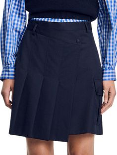 Short pleated skirt with asymmetric front section, belt loops, press-stud fastening and cargo pocket with flap on the side. Sandro Women's short pleated skirt Asymmetrical section Belt loops Flap pocket on the side Main fabric: 55% polyester, 45% virgin wool Imported SIZE  FIT Model measurements: 5'9'' Model is wearing a size 4 Workwear Skort With Belt Loops, Fitted Asymmetrical Skirt With Side Pockets, Workwear Short Pleated Skirt With Belt Loops, Workwear Pleated Skirt With Belt Loops, Short Length, Fitted Asymmetrical Cargo Skirt For Work, Asymmetrical Skirt With Pockets For Work, Workwear Asymmetrical Skirt With Side Pockets, Asymmetrical Workwear Skirt With Side Pockets, Asymmetrical Work Skirt With Side Pockets