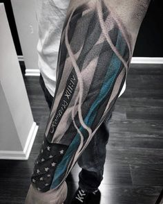 a man's arm with an american flag tattoo on it