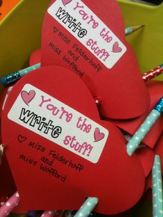 valentine's day candy stickers with writing on them are in a heart shaped box