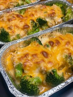 two metal pans filled with broccoli and cheese casserole