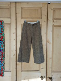 "Moschino Wool Tweed, Low waisted, Wide leg Trousers, Small (8) -Authentic Designer  -Wool tweed -Wide leg -Condition is excellent/like new; no stains marks or holes Sizing: Small (8) Measurements: Waist 13.5\" Outer leg 36\" Inner leg 27\" Front rise 9\"" Tweed Bottoms With Pockets For Work, Fall Tweed Bottoms With Pockets, Fall Tweed Trousers, 70s Platform Shoes, Womens Leather Biker Jacket, Womens Trousers, Racing Jacket, Leather Trench Coat, Jumper Shirt