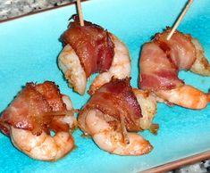 bacon wrapped shrimp on skewers with toothpicks