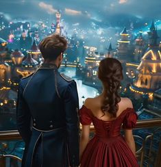 a man and woman looking out over a city at night