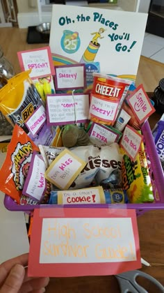 a purple basket filled with lots of candy