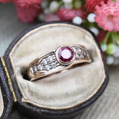 A beautiful vintage 9ct rose gold ring, set with a large central synthetic ruby. A gorgeous piece of vintage Millennium jewellery, this would make a wonderful cocktail or occasional ring. In really nice vintage condition. Please see all of the photos. Stamped with UK hallmarks to the inside for 9ct gold, 1999. UK Size - N US Size - 6 1/2 Weight - 2.7 grams --------------------- All boxes and stands in the photographs are for display purposes only, unless otherwise stated. Please be aware there w Rose Gold Hallmarked Birthstone Ring For Anniversary, Vintage Hallmarked Rose Gold Diamond Ring, Classic Rose Gold Ruby Ring For Anniversary, Victorian Rose Gold Ruby Ring For Anniversary, Hallmarked Rose Gold Ruby Ring, Vintage Rose Gold Diamond Ring With Gemstone, Vintage Ruby Ring With Bezel Setting For Anniversary, Vintage Rose Gold Ruby Ring, Heirloom Ruby Ring In Rose Gold For Anniversary