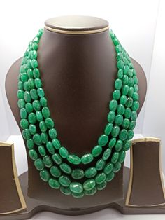 18'' Emerald Beryl AAA 960 Carat Fine Quality Emerald Beryl Smooth Tumble Beads Gemstone adjustable cord Necklace Stone  : emerald beryl  Shape :- fancy  smooth tumble 1. Weight :- 960 carat - Size - 8x10-12x17mm - 18 inch 4 Line Necklace Polish :- Handmade color - green makes a great gift for your loved ones. It is known as the 'love stone' as the message it emits is the strong vibration of unconditional love, joy, warmth and healing. As quartz crystals are profound amplifiers of energy, it may help to kindle happiness, love, romantic feelings and sensuality. It is good for people in public dealing  Click below to see live stock:  https://www.etsy.com/au/shop/ShakugemsStore?ref=search_shop_redirect If for any reason you are not satisfied with your purchase. You can return it for a full re Traditional Oval Necklaces With Polished Beads, Emerald Necklace With Oval Gemstone Beads For Jewelry Making, Oval Emerald Bead Necklace For Jewelry Making, Adjustable Gemstone Necklace With Oval Beads, Adjustable Necklace With Gemstone Oval Beads, Adjustable Oval Necklace With Natural Stones, Adjustable Oval Beads Gemstone Necklace, Green Oval Gemstone Beads Necklace, Oval Emerald Gemstone Beads Necklace Gift