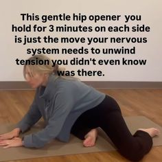 a woman is doing yoga on a mat with the words, this gentle hip opener you hold for 3 minutes each side is just the move your nervous system needs to unwind tension you didn't even know