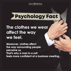 a man adjusting his tie in front of a sign that says,'the clothes we wear effect the way we feel '