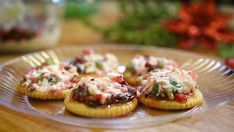 small appetizers are sitting on a clear plate