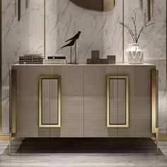 an elegant console with two doors and gold trim on the sideboard in a living room