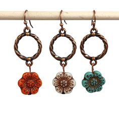 Czech glass flower dangle earrings in copper with your choice of bead color: Red-Orange, White or Turquoise flower.  Fun and festive handmade jewelry. Dress these flower earrings up or wear them casually. Hypoallergenic ear wires (nickel and lead free). Choose ear wire style at checkout. Artisan glass beads produced in small quantities in the Czech Republic A gift for you or someone special, earrings are carded and in an organza bag. Link back to my shop: https://www.etsy.com/shop/JezaJewelry Cz Nickel-free Czech Glass Flower Earrings, Adjustable Copper Flower Earrings, Adjustable Copper Flower Jewelry, Handmade Copper Flower Earrings, Nickel-free Flower Shaped Copper Jewelry, Nickel-free Copper Flower Jewelry, Nickel-free Flower-shaped Copper Jewelry, Nickel-free Orange Flower Earrings, Bohemian Copper Flower Jewelry