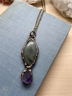 "This listing is for one electroplated statement necklace featuring labradorite and amethyst quartz. It's beautiful and unique, and gives off major Dark Crystal vibes! You may pick the chain length at check out. I recommend between 18-24\" for this necklace, but can do any length from 14-30\". The chain itself may be slightly different than the one in the photograph, depending on what supplies I have available when you order. The chain is nickel, lead, and cadmium free. Your necklace will be sto Handmade Minimalist Jewelry With Mineral Crystal, Handmade Minimalist Mineral Crystal Jewelry, Minimalist Wire Wrapped Labradorite Jewelry, One Of A Kind Amethyst Jewelry, Handmade Minimalist Bronze Necklace, Minimalist Handmade Bronze Necklace, Unique One-of-a-kind Amethyst Jewelry, Unique Hand Forged Purple Necklaces, Nature-inspired Amethyst Healing Jewelry