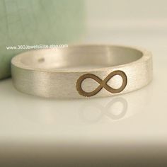 "3mm wide sterling silver wedding band with infinity sign engraved in the front. SPECIFICATION Approximate Ring Width: 3mm Base metal: 925 Sterling Silver Other Custom Options: See below Accessory : Chamois-like jewelry cloth bab (while supply lasts) We will make your ring in approximately 3-5 weeks. Be sure to leave a message to specify the size you would like. INSTRUCTIONS FOR CUSTOMIZATION 1. Checkout and make a payment for this men's black gold wedding band 2. Specify details in the Message Infinity Stackable Jewelry For Anniversary, Elegant Nickel-free Stackable Rings For Wedding, Elegant Nickel-free Stackable Wedding Rings, Symbolic Infinity Jewelry For Anniversary, Infinity Stackable Rings For Wedding, Infinity Stackable Wedding Rings, Personalized Silver Infinity Ring, Personalized Infinity Silver Ring, Silver Infinity Ring For Wedding