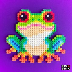 a frog made out of legos on a purple background