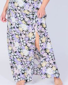 Pair this plus-size maxi skirt with the matching crop top. Spring Maxi Skirt With Split Design, Spring Skirt With Side Slits And Split Hem, Maxi Length Bottoms With Side Slits For Spring, Spring Maxi Length Bottoms With Side Slits, Summer Maxi Skirt With Side Slits, Spring Maxi Bottoms With Side Slits, Summer Full Length Maxi Skirt With Side Slits, Summer Full-length Maxi Skirt With Side Slits, Spring Beach Maxi Skirt With Side Slits