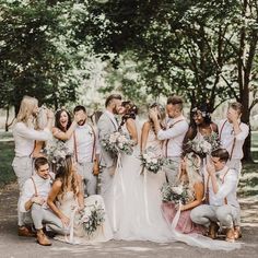 a group of people that are standing in the street together with flowers on their heads