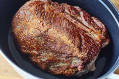 a piece of meat in a pan on a table