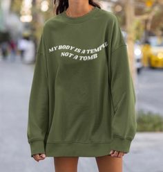 Minimalist and cute 'My Body is a Temple not a Tomb' sweatshirt perfect for the animal lover or vegan in your life! If you like a baggy fit like me then size up! A sturdy and warm sweatshirt bound to keep you warm in the colder months. A pre-shrunk, classic fit sweater that's made with air-jet spun yarn for a soft feel and reduced pilling. 🤎 Product Details: These are unisex sweaters, so they're great for everyone! If you're like me and you prefer a bit of an oversized fit, then I recommend siz No Planet B, Animal Sweater, Friends Sweatshirt, Lover Sweatshirt, Vegan Gifts, Mom Sweatshirt, Animal Rights, Going Vegan, Fitted Sweater