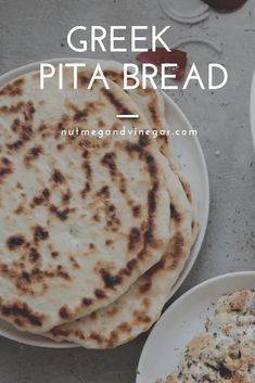 greek pita bread is served on white plates