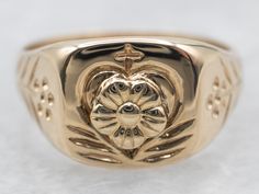 This stunning yellow gold signet ring boasts a delicate floral design. Crafted to the highest quality standards, this ring ensures elegance and style with every wear. The perfect accessory for any occasion.Metal: 14K Yellow GoldTop Measurements: 9.5 mm, SquareRing Size: 5.50 Classic Yellow Gold Flower Promise Ring, Classic 14k Stamped Yellow Gold Flower Ring, Classic 14k Gold Flower Ring, Classic 14k Gold Flower Ring For Anniversary, Classic Oval Yellow Gold Flower Ring, Classic 14k Gold Flower Promise Ring, Classic Oval Flower Ring In 14k Gold, Classic Oval 14k Gold Flower Ring, Classic 14k Gold Flower Ring For Formal Occasions