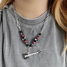 𝔇𝔢𝔱𝔞𝔦𝔩𝔰: Style: Egirls, Y2K, Kawaii Goth Materials: Alloy Metal & Stone Quantity: 1 pc (As shown) This is a handmade one with special star & cross beads to create a punk & edgy vibe. Rock out in style with this flaming guitar necklace. It will make for a fantastic addition to your accessory collection - whether at school or bands Solid & durable quality Enjoy free shipping with a purchase of over 80$ Black Rock Jewelry, Harajuku Style Black Jewelry, Trendy Handmade Jewelry For Concerts, Casual Black Jewelry For Concerts, Handmade Black Jewelry For Concert, Handmade Black Jewelry For Concerts, Emo Style Black Necklace For Festival, Casual Black Beaded Necklace As Gift, Casual Black Beaded Necklace For Gift