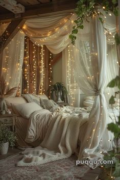 an unmade bed with white curtains and fairy lights