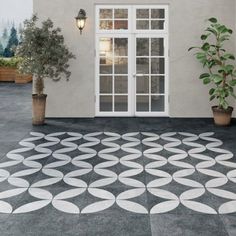 an outdoor patio with potted plants and tables