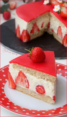 a piece of cake with strawberries on top